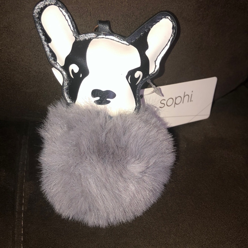 Purplish/ Grey Pom Pom Keychain With a Black and White Dog and Gold Hardware